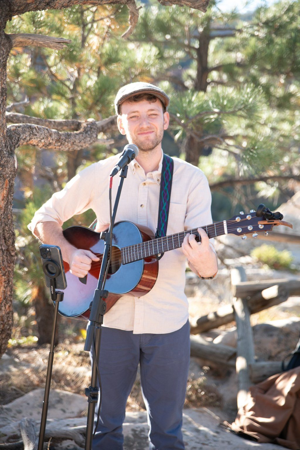 A guitarist playing outdoors at a wedding.