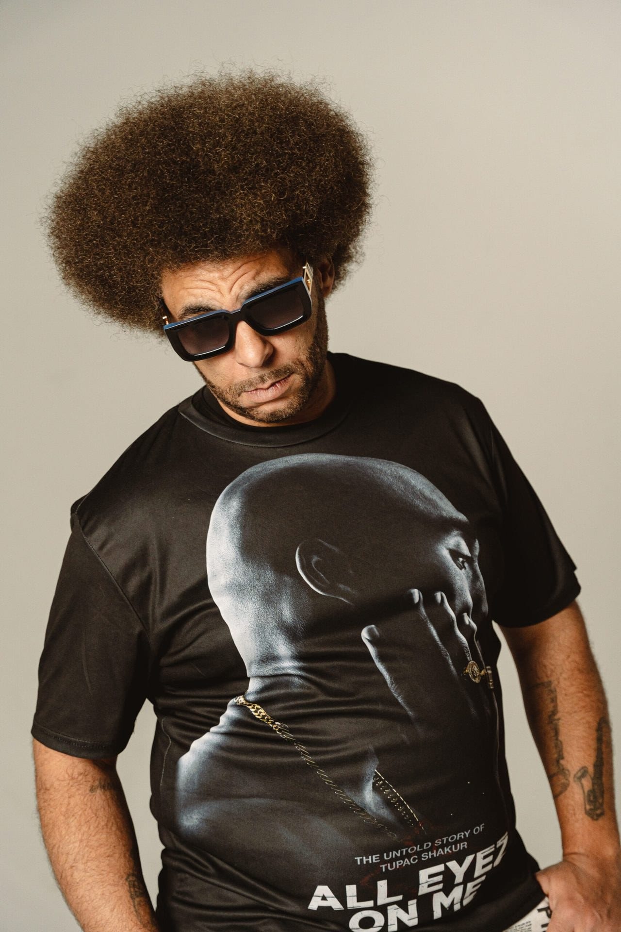 Little Moses Jones in sunglasses and a black T-shirt.